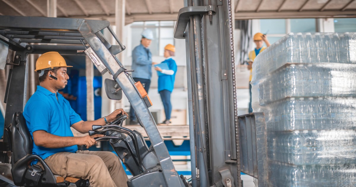 Forklift Operator loading Aluminum cans
